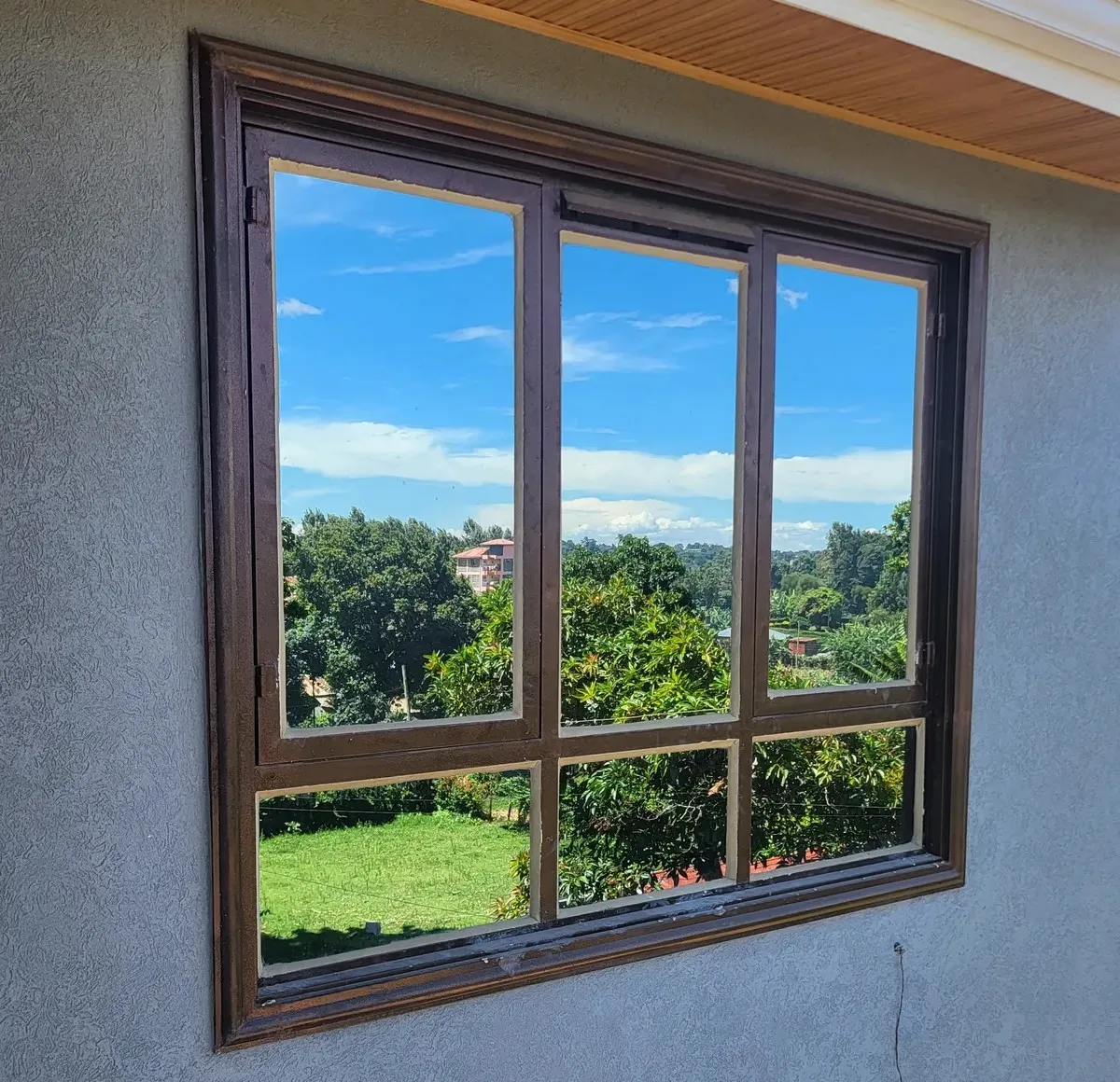 Aluminium-framed steel window installation on a residential building